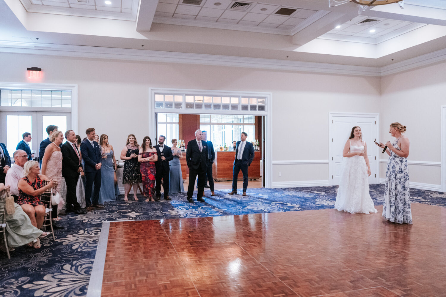 wide shot of the maid of honor giving her reception speech
