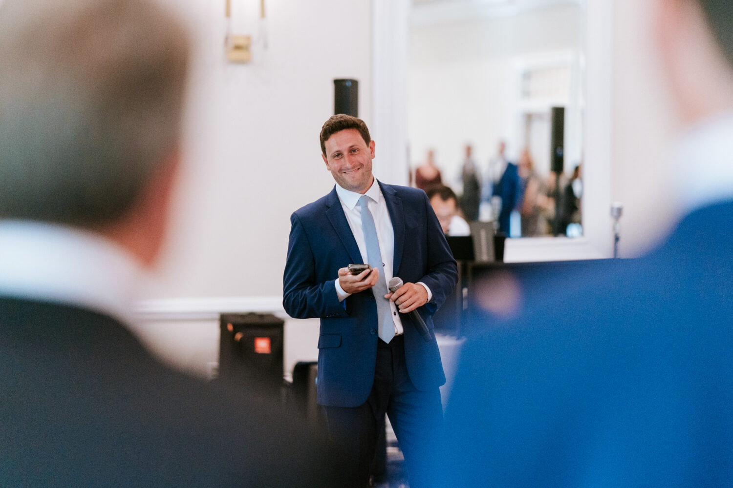 best man smiling while giving his reception speech