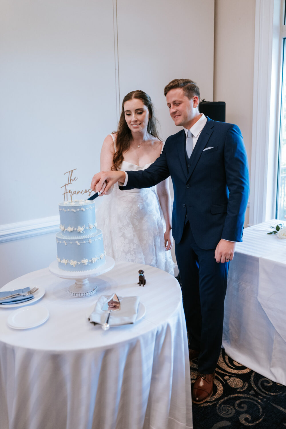 bride and groom cutting their wedding cake