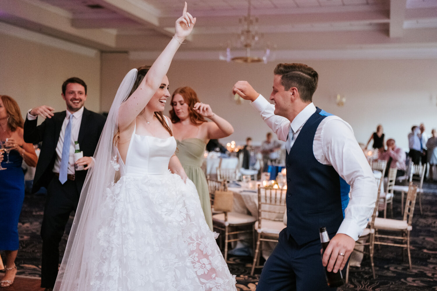 bride and groom dancing together during their wedding reception
