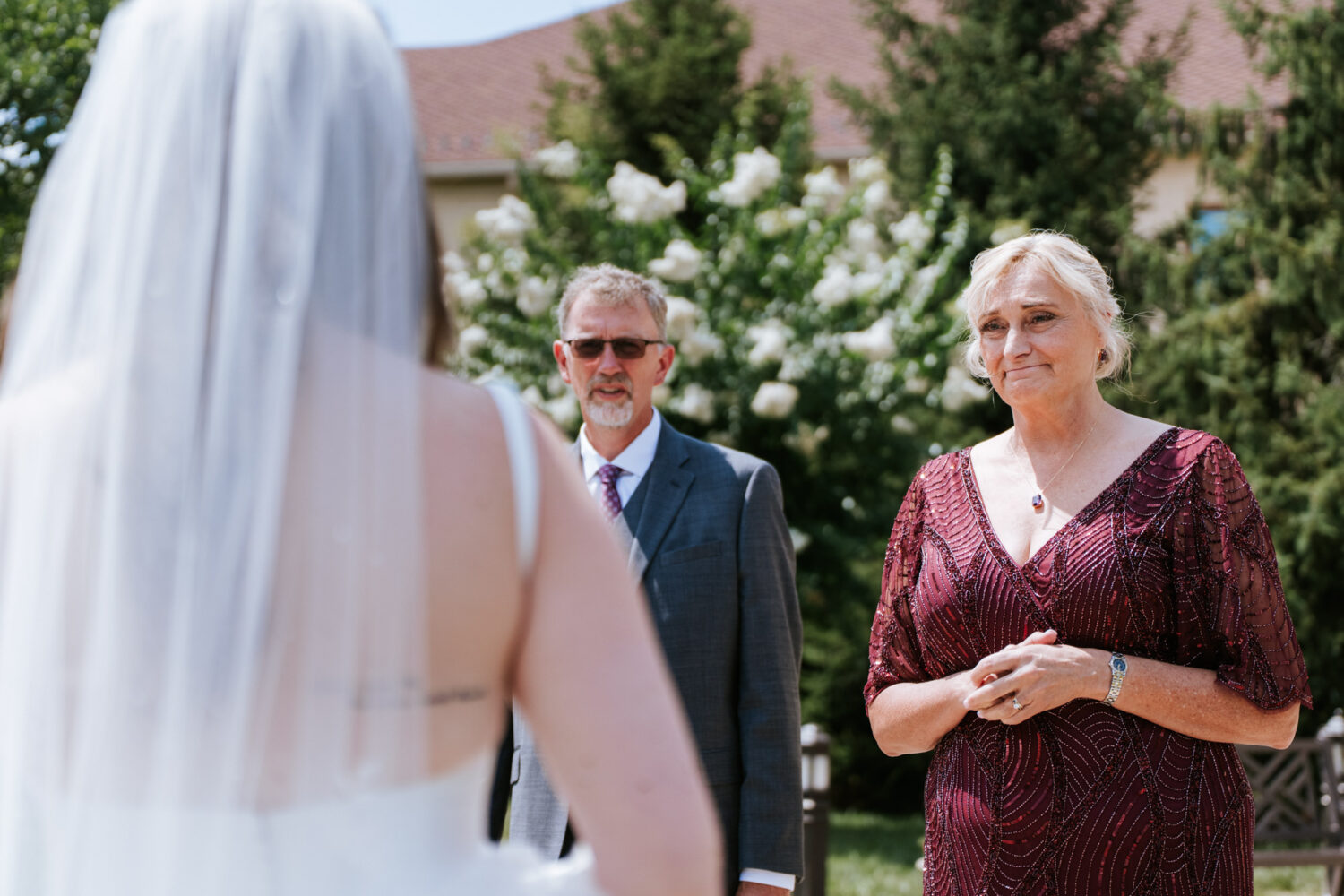 mother of the bride looking at her daughter for the first time