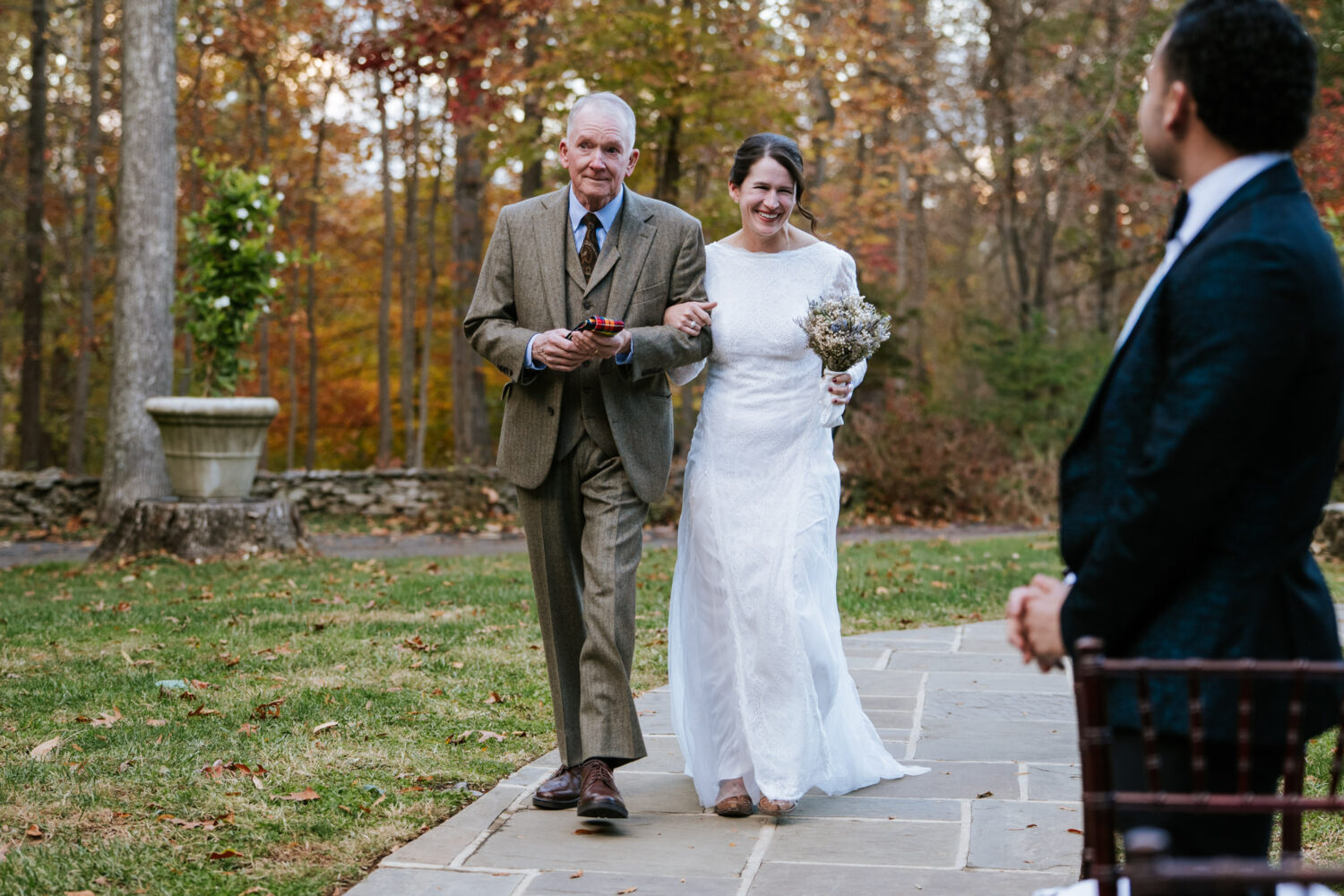 Bride walking down the aisle with her father at Goodstone Inn ceremony