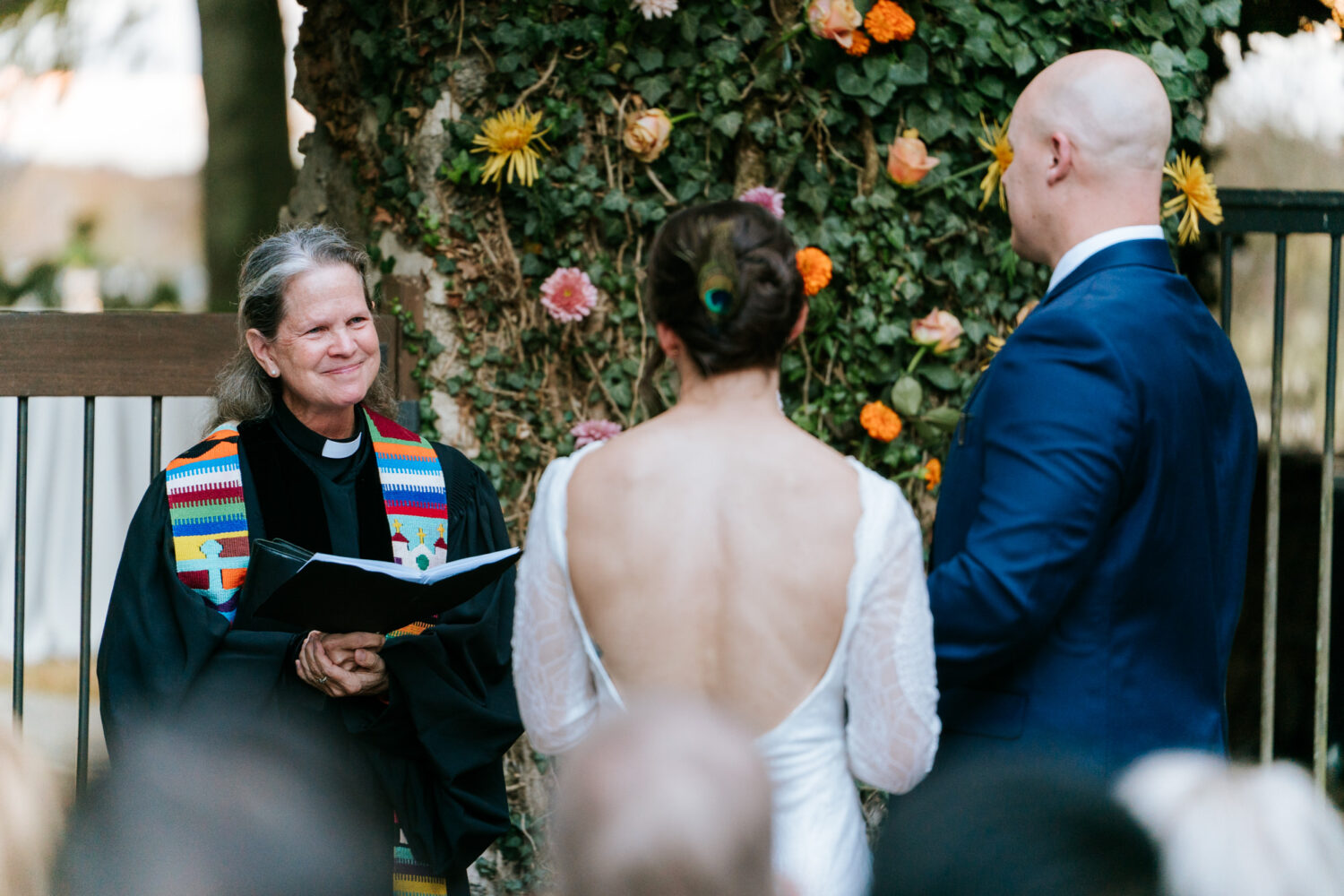 Wedding officiant smiling at couple during Goodstone Inn ceremony