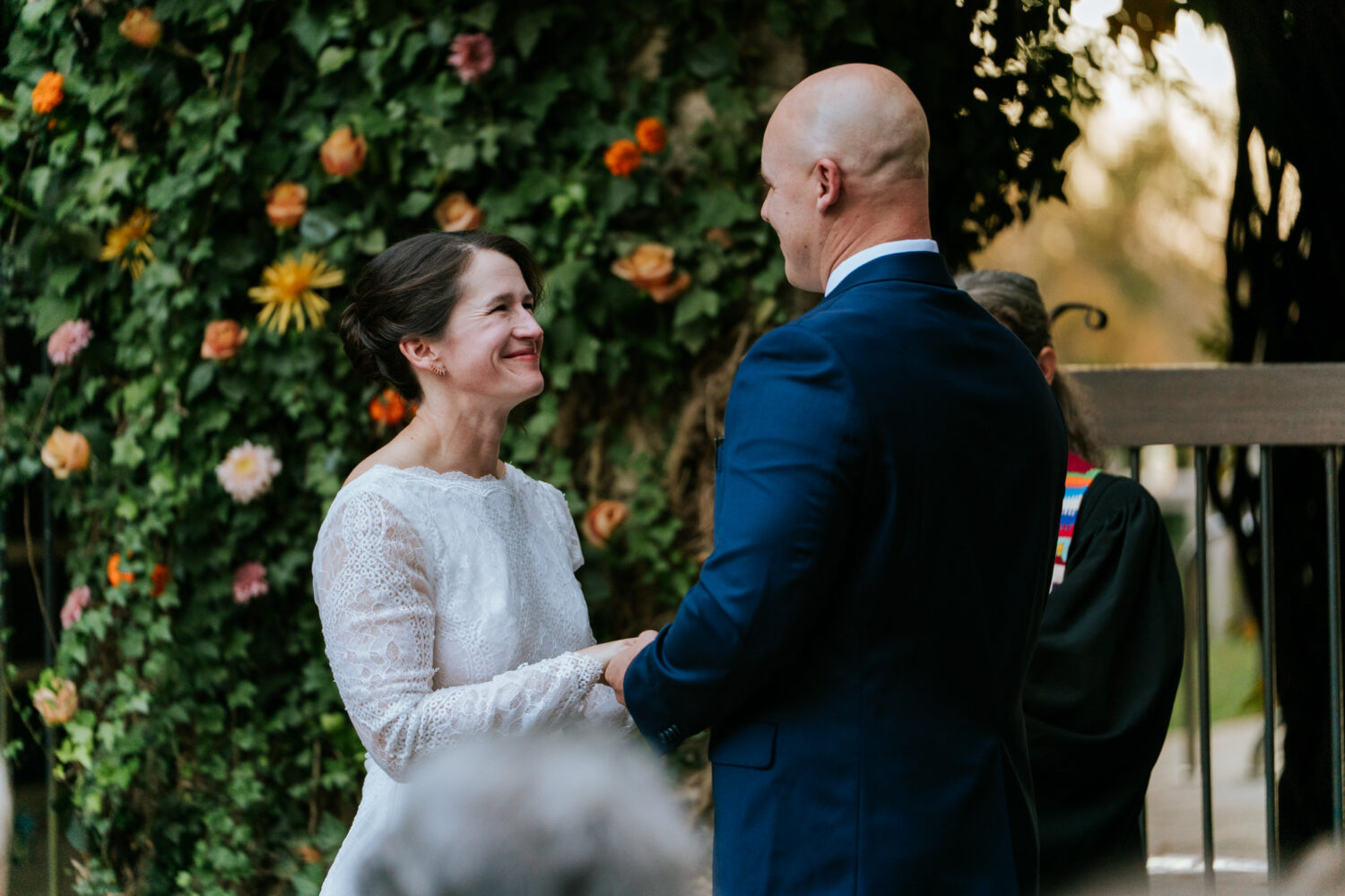 Bride looking lovingly at groom during ceremony