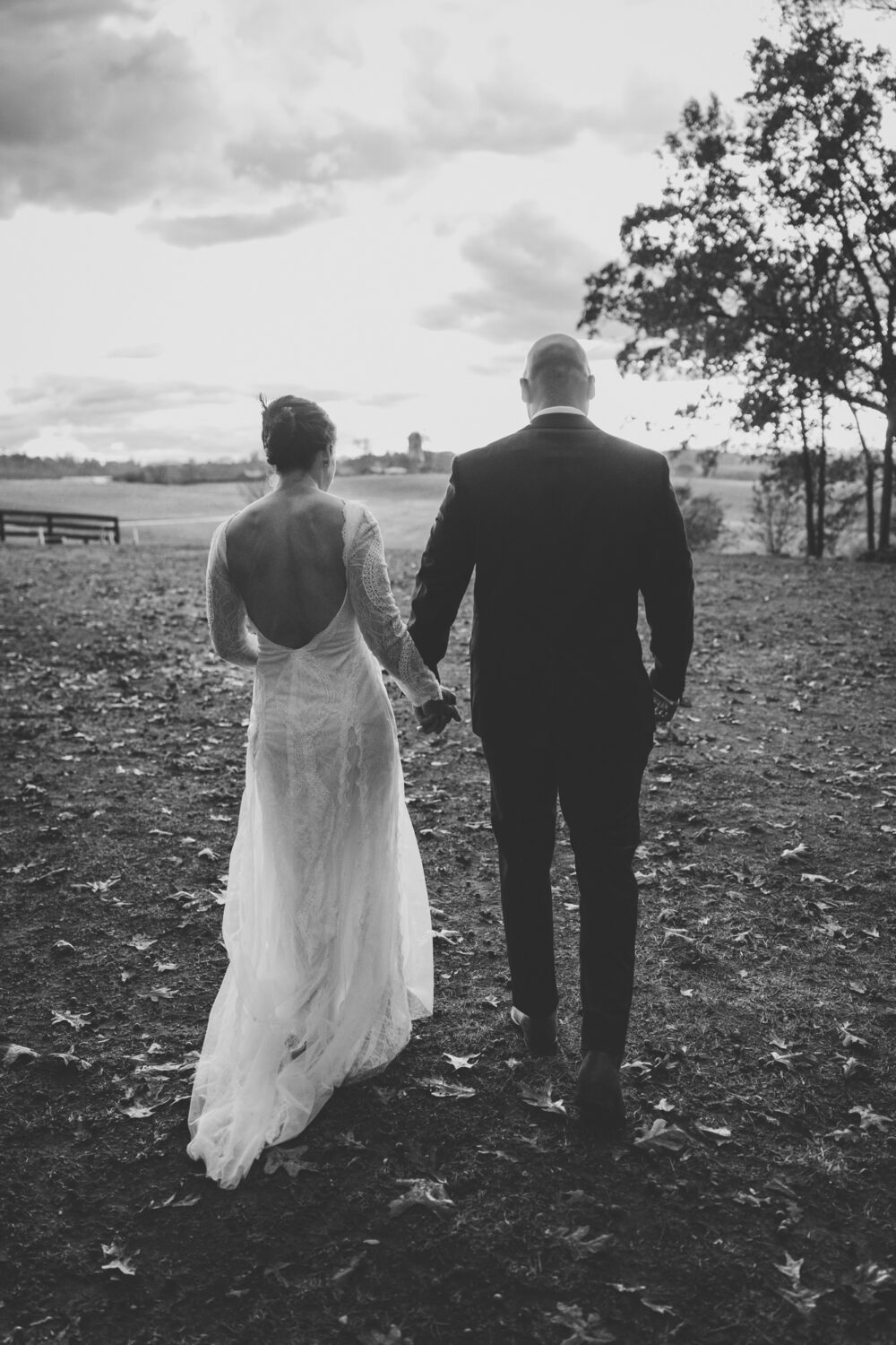 bride and groom portrait walking away from the camera