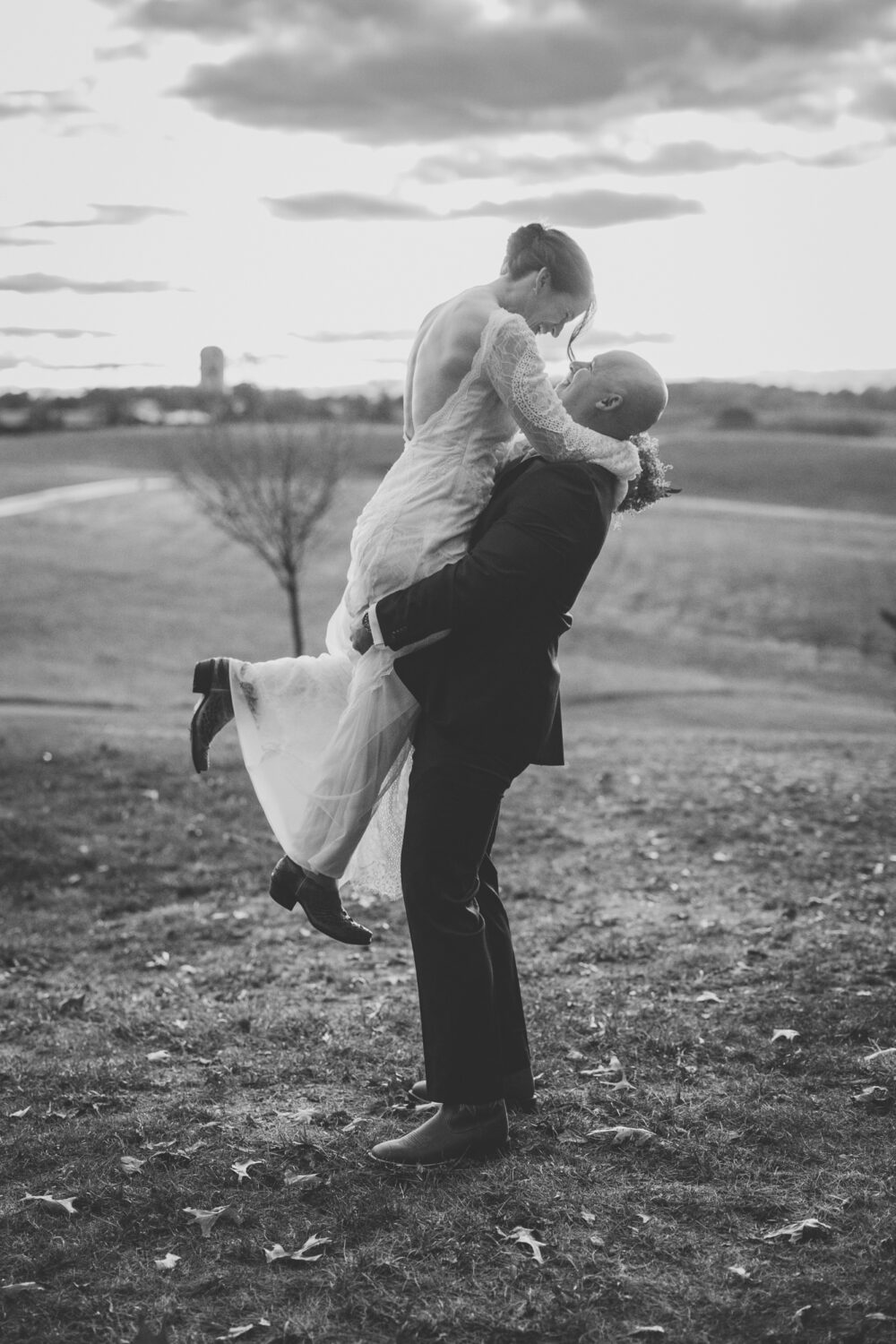 groom lifting bride off her feet during their Goodstone inn wedding day