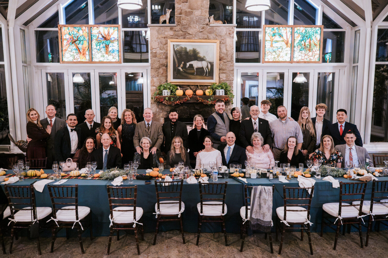 Group portrait of all wedding guests with bride and groom at Goodstone Inn