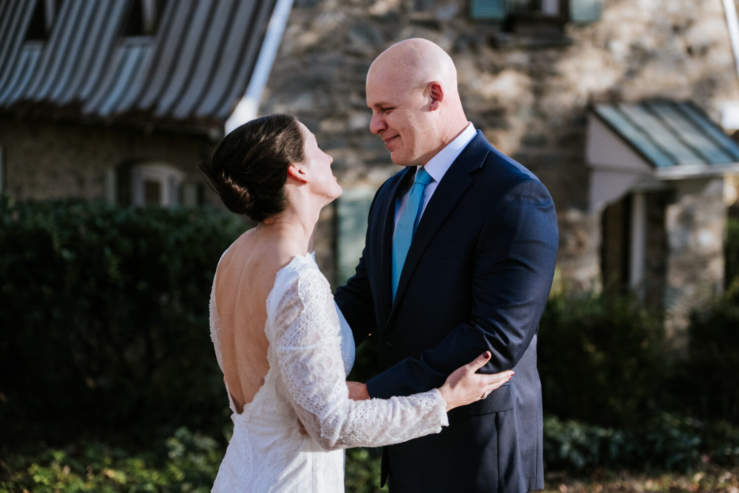 Groom smiling as he sees bride for the first time at Goodstone Inn