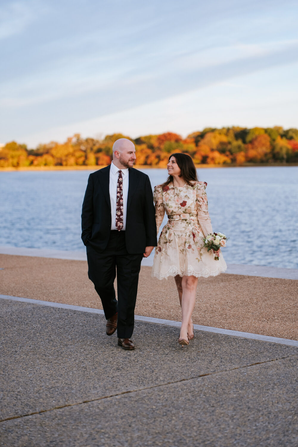 Fall Jefferson Memorial engagement photos by the Tidal Basin with colorful autumn trees in DC