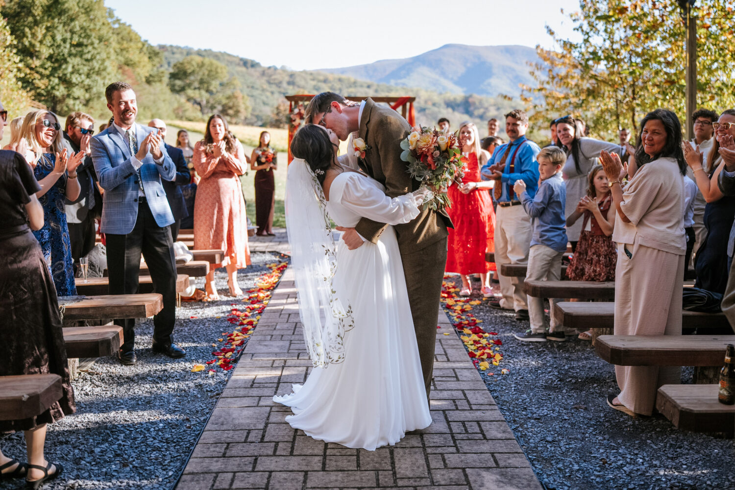 Bride and groom share a kiss after saying “I do” at Shenandoah Woods wedding
