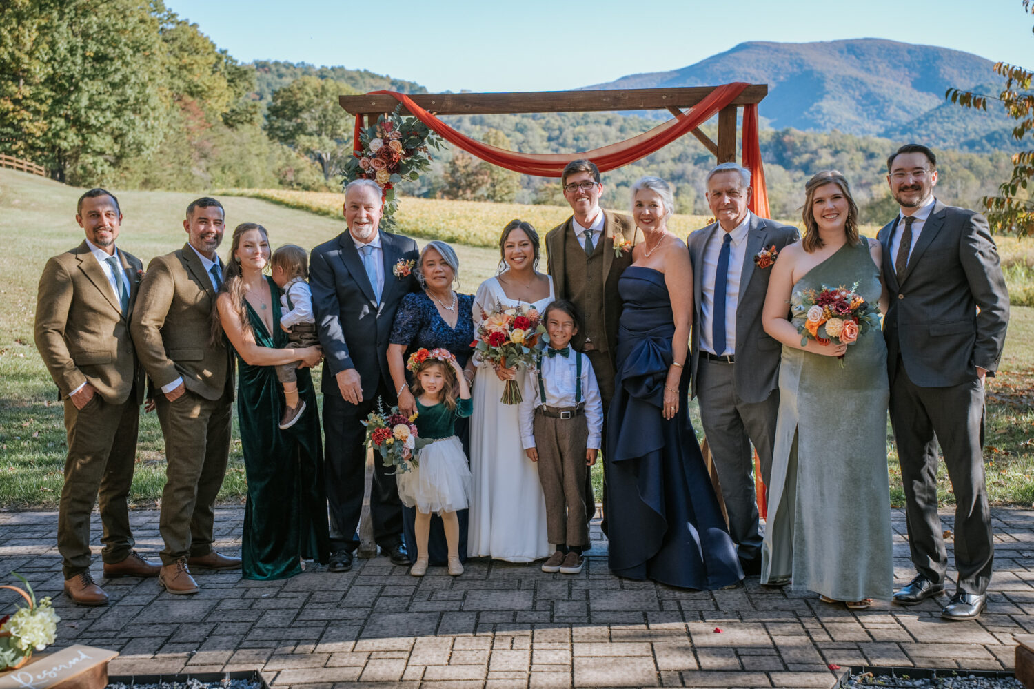 Post-ceremony family photo with bride and groom at Shenandoah Woods wedding venue
