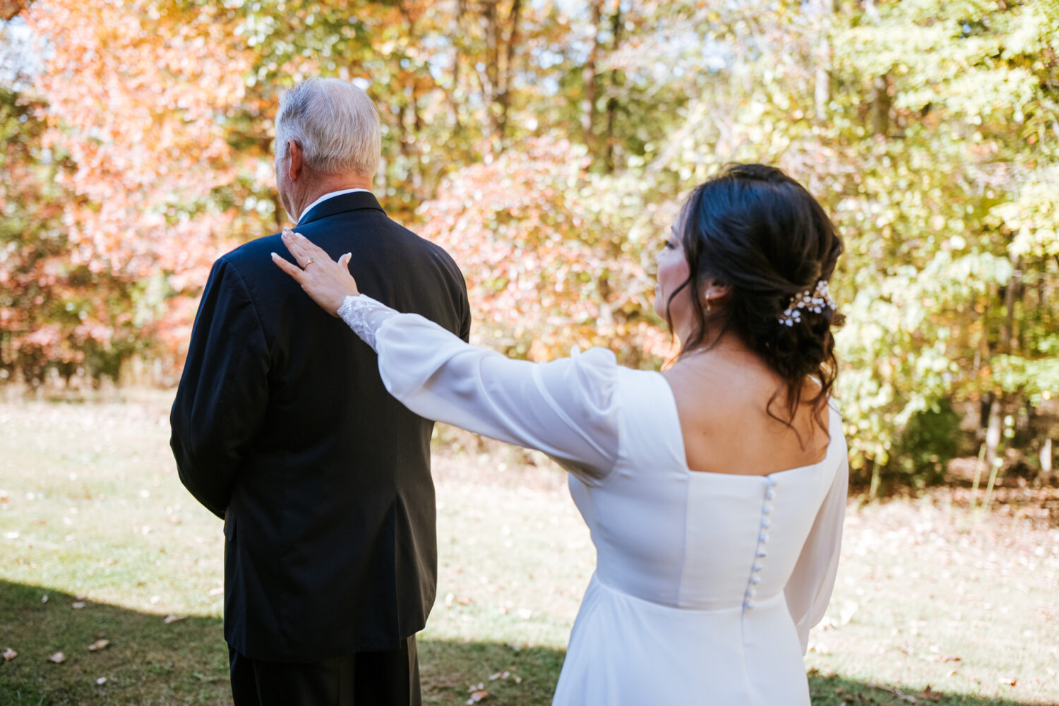 Bride surprising her dad during a first look at her Shenandoah Woods wedding
