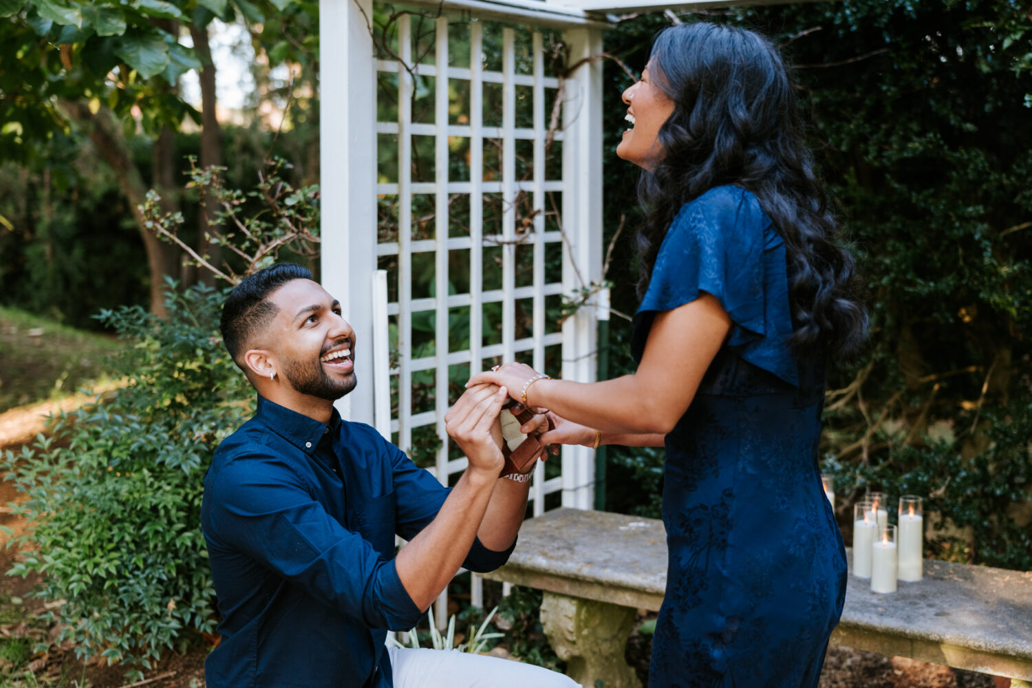 Man proposing to a woman outdoors at Oatlands Historic House & Gardens in Leesburg VA