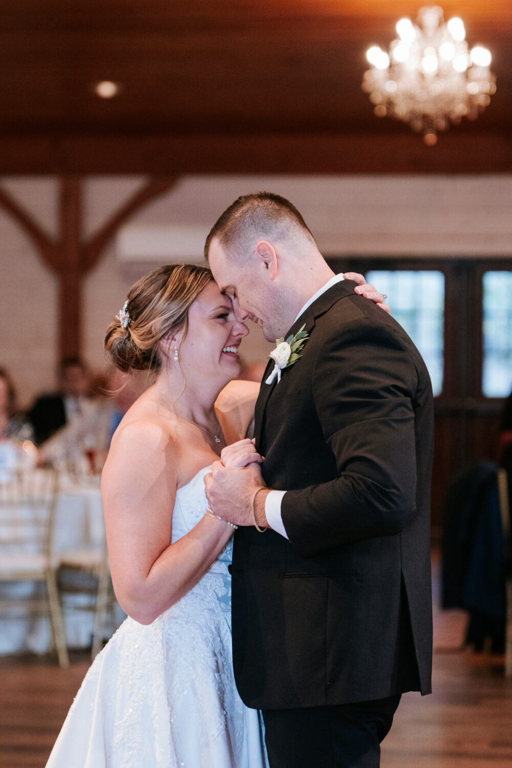 Close-up of bride and groom during first dance at their wedding reception
