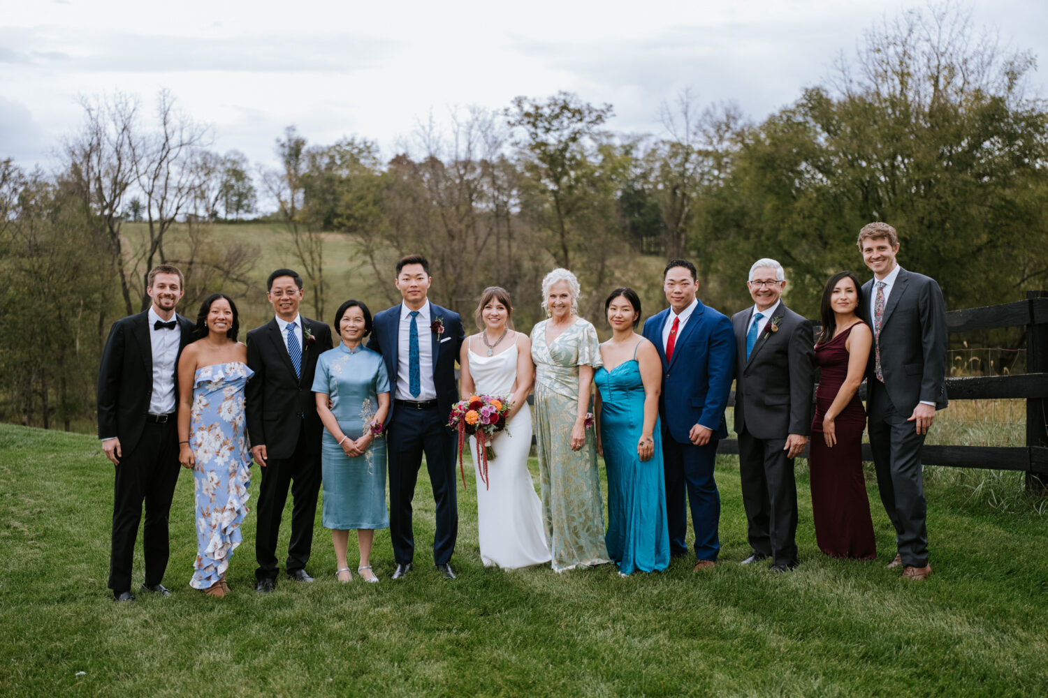Family portrait with bride and groom at their Willow Brook Barn wedding
