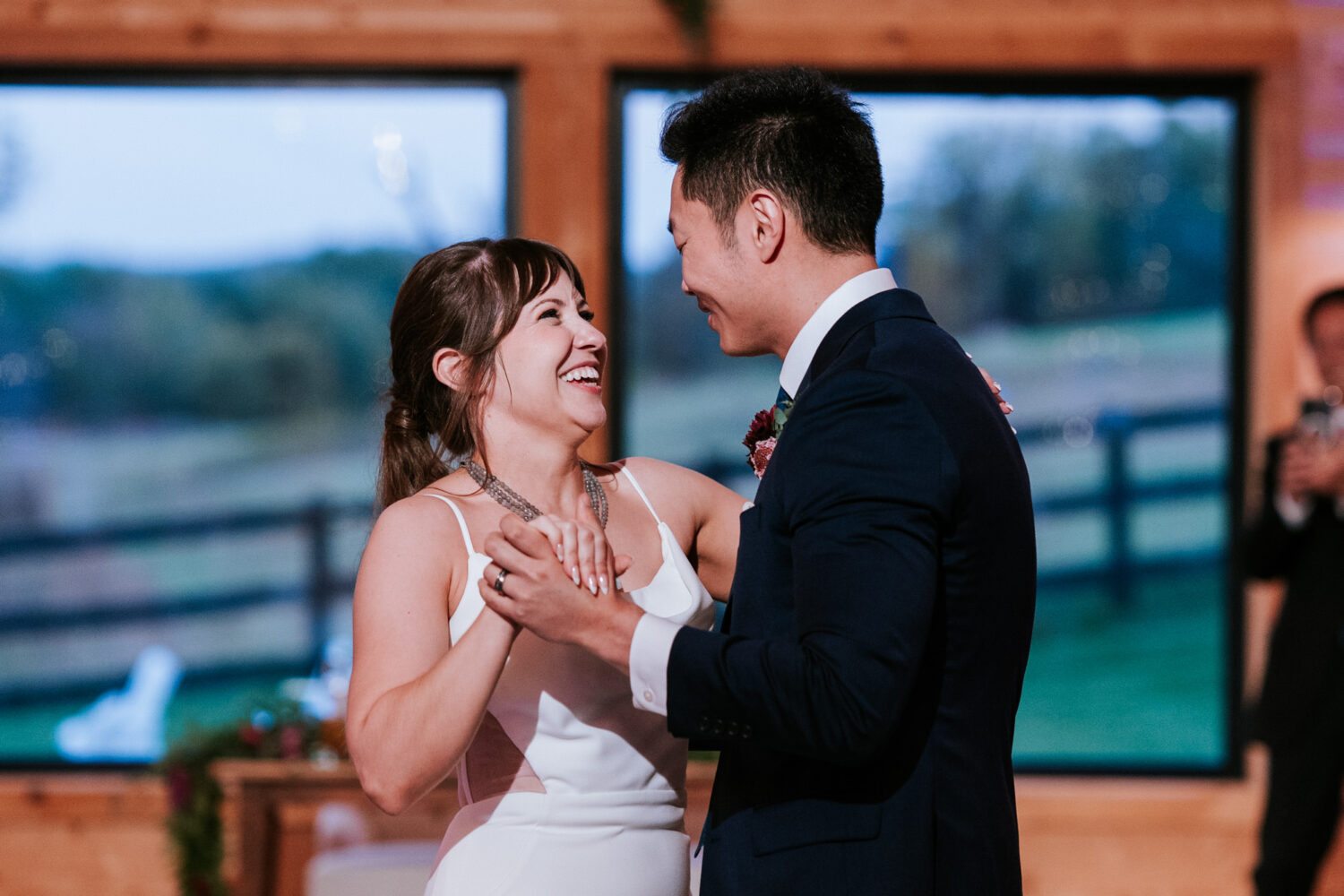 Bride and groom sharing their first dance during Willow Brook Barn wedding reception
