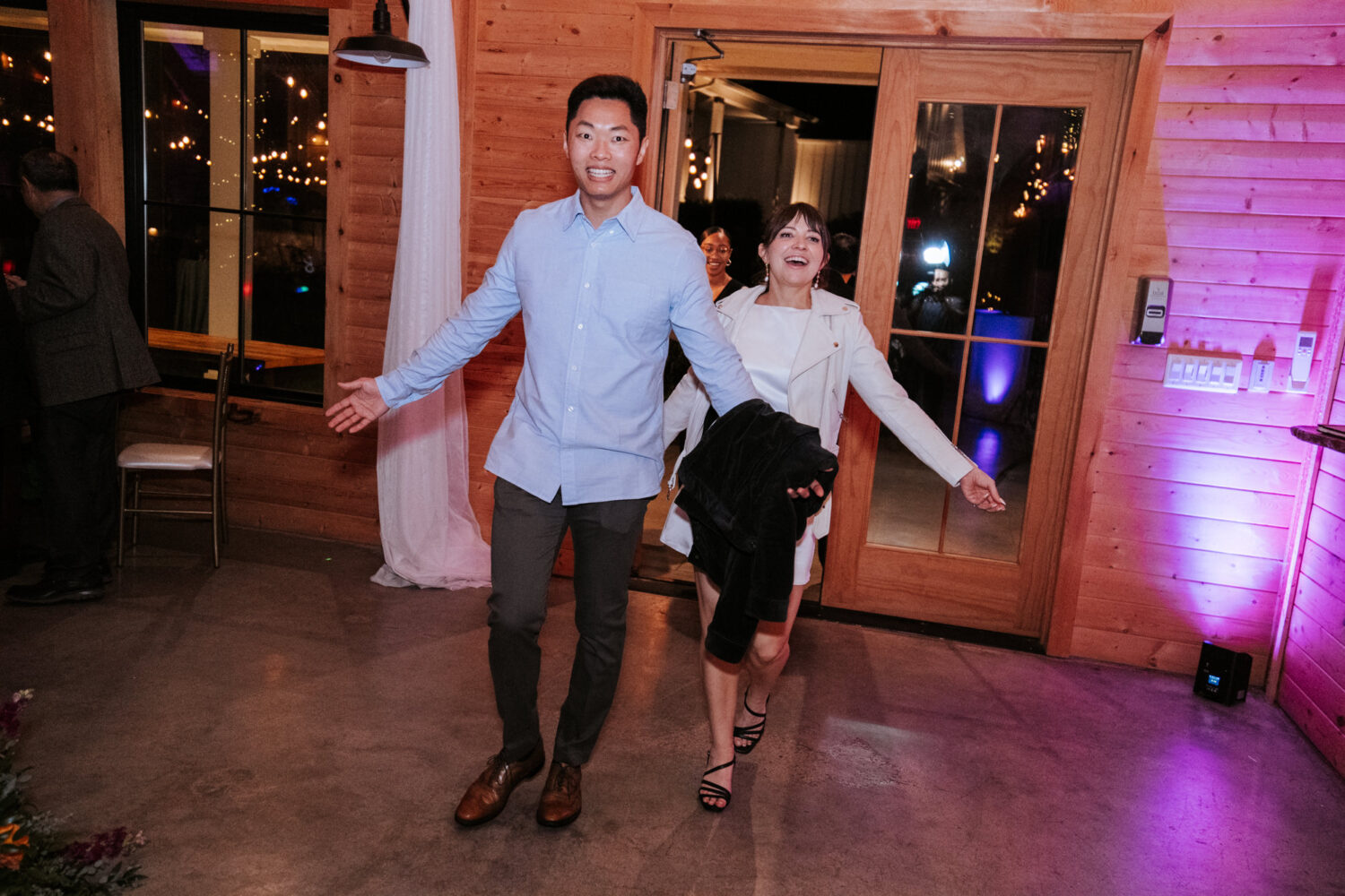 Bride and groom reenter the reception in fun late-night outfits
