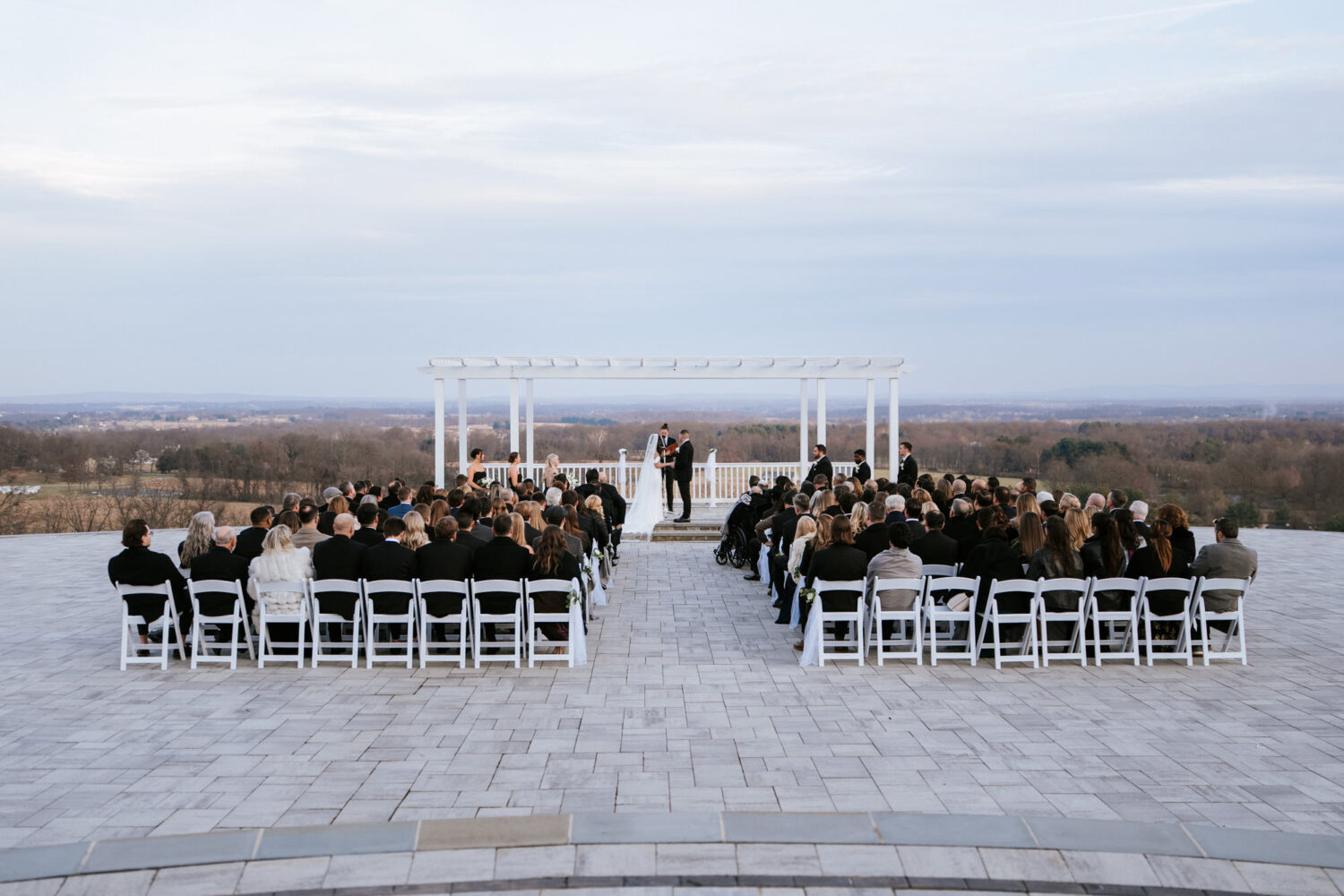 Wide ceremony view at The View at Bluemont with guests seated outdoors