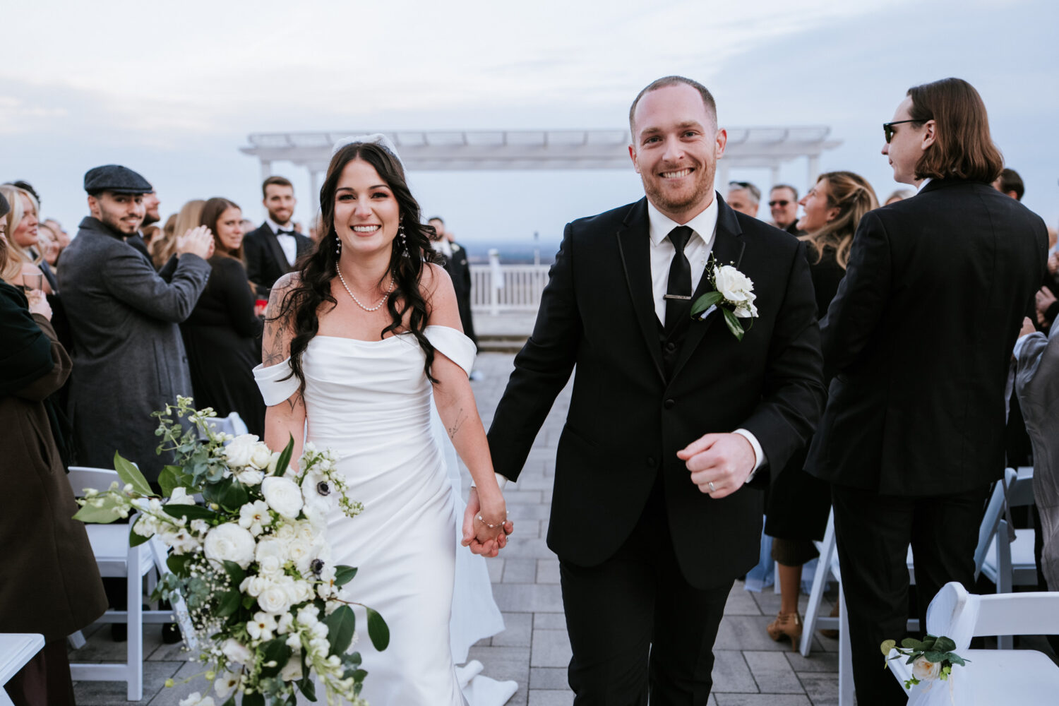 Bride and groom walking down the aisle after outdoor wedding ceremony at The View at Bluemont