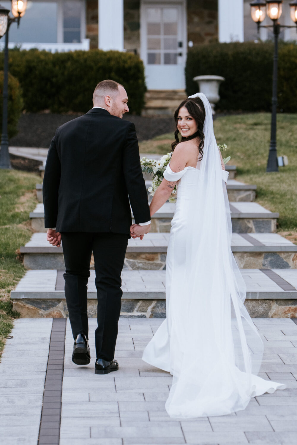 Bride and groom walking hand in hand at The View at Bluemont wedding