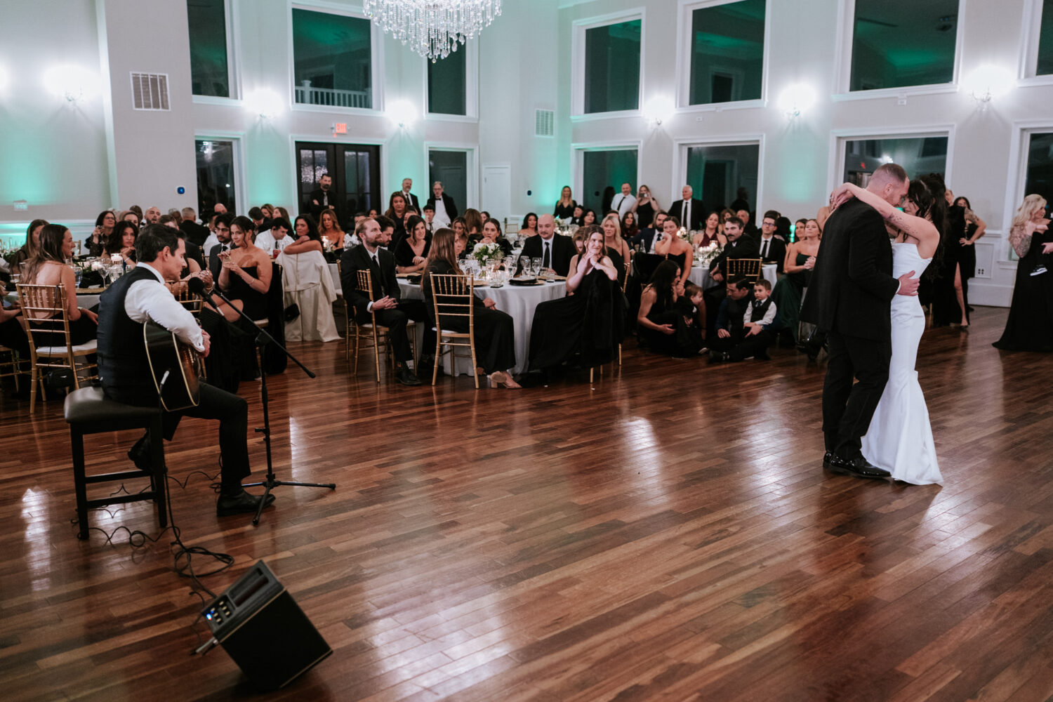First dance during live music performance at wedding reception